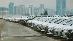A forecourt lined with cars.